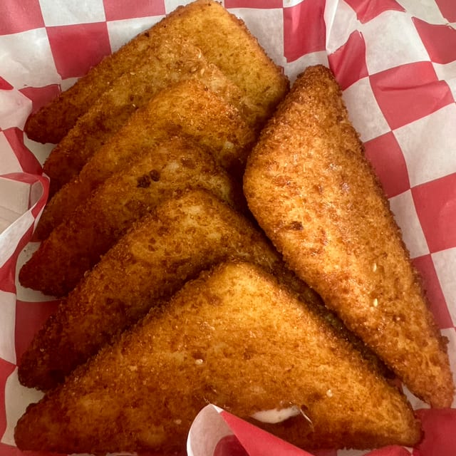 Fried Mozzarella Sticks with Marinara Sauce.
